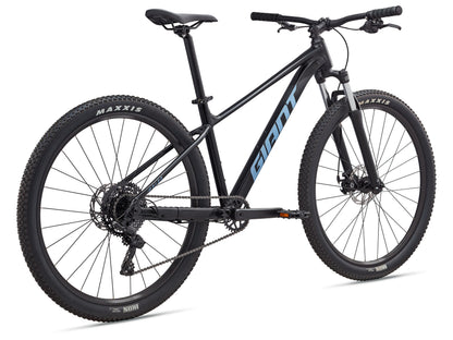 Black mountain bike with Maxxis tires on a white background