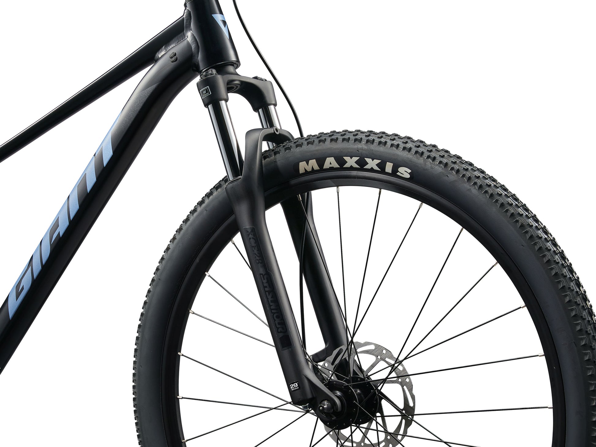 Close-up of a bicycle wheel with Maxxis tire on a white background