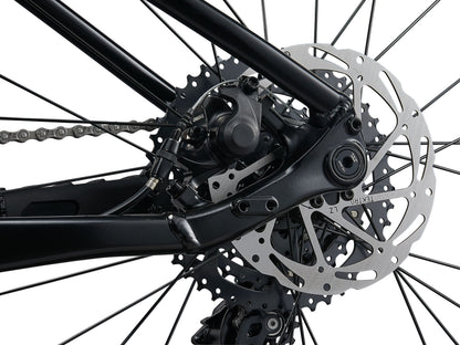 Close-up of a bicycle's rear wheel and gear system on a white background