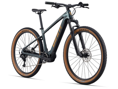 Electric bicycle with Maxxis tires on a white background