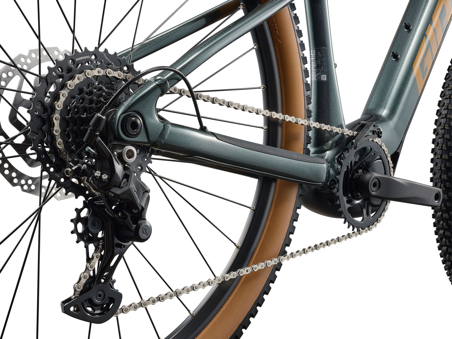 Close-up of a bicycle's gear system on a white background