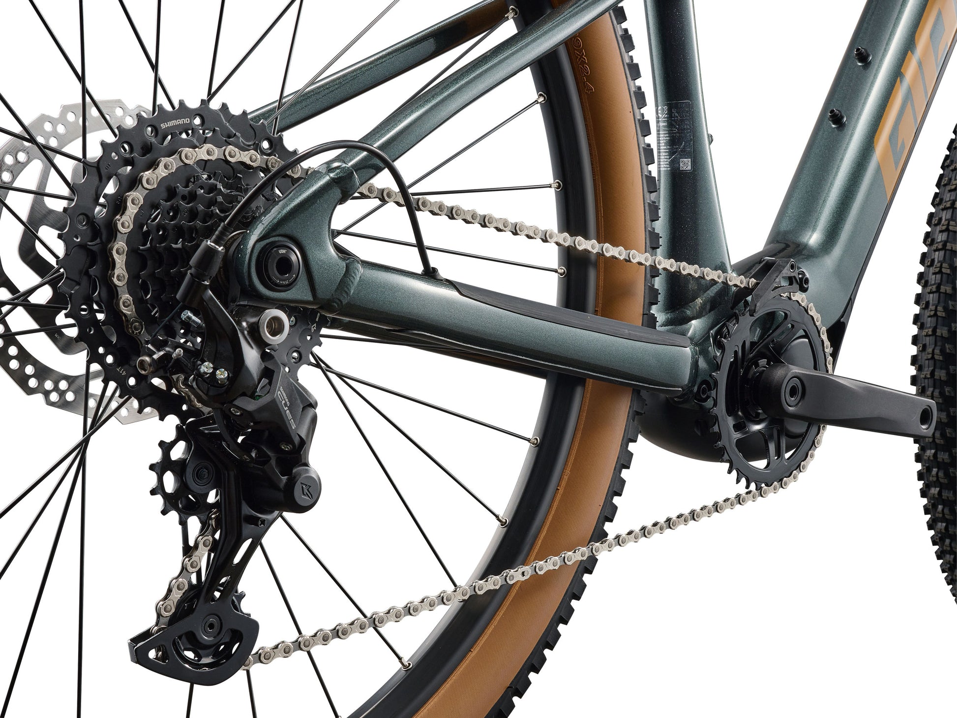 Close-up of a bicycle's gear system on a white background