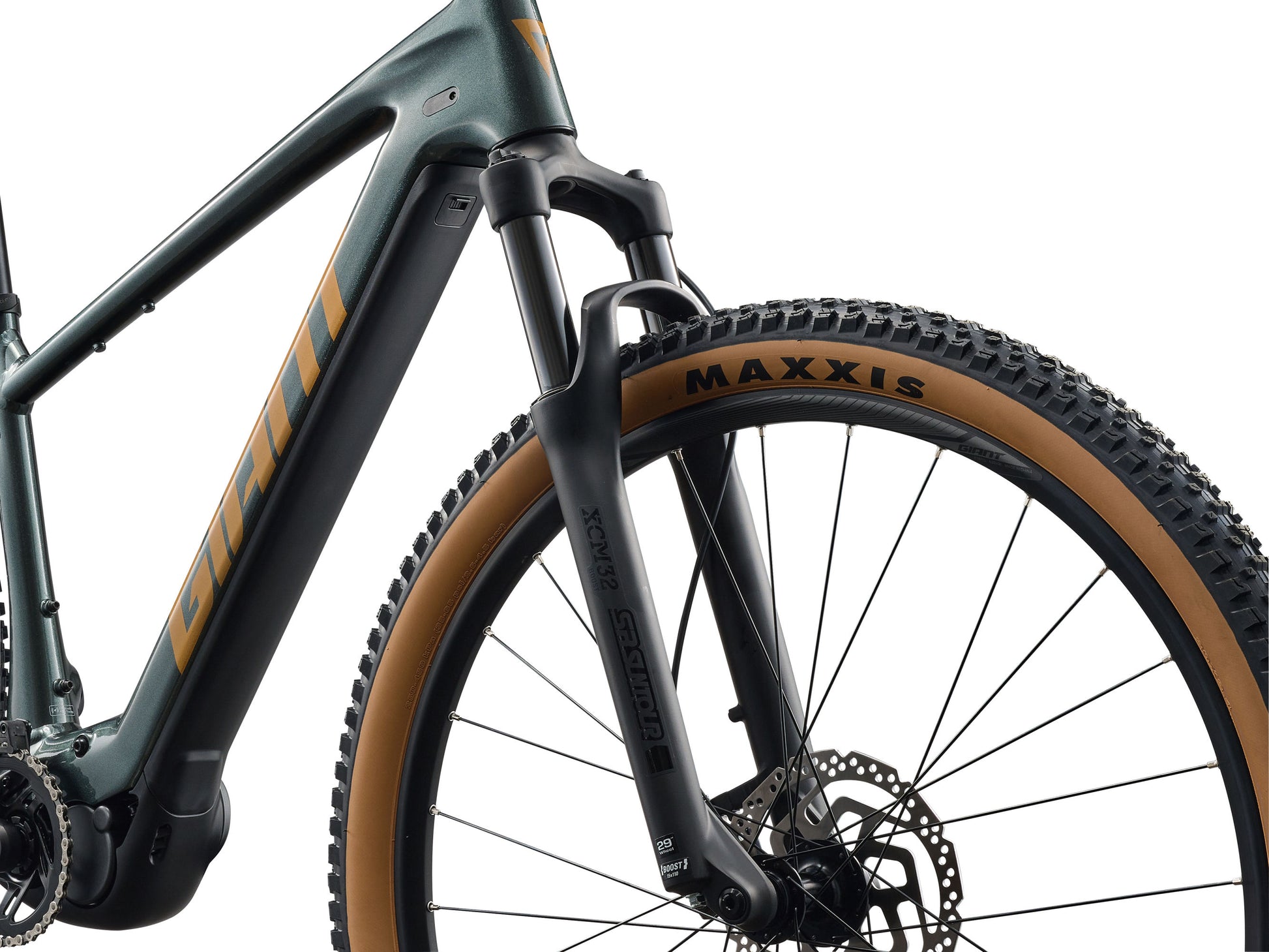 Close-up of a bicycle frame with 'Maxxis' tire on a white background