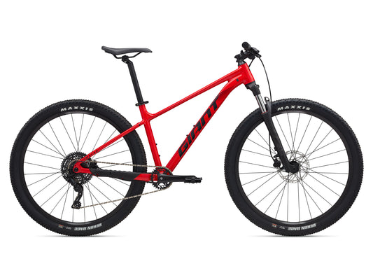 Red bicycle with black components on a white background