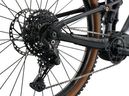 Close-up of a bicycle's rear wheel and gear system on a white background