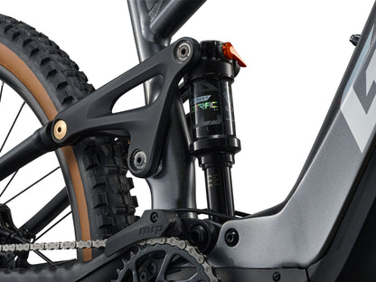 Close-up of a mountain bike's suspension fork and chain on a white background