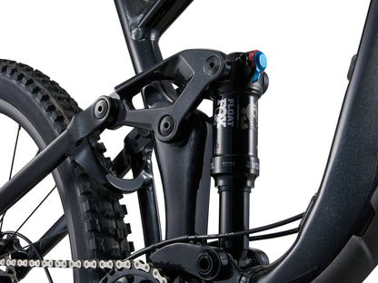 Close-up of a bicycle suspension fork with visible branding on a white background