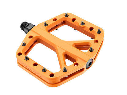 Orange bicycle pedal with black bolts on a white background