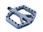 Blue bicycle pedal with multiple mounting holes on a white background