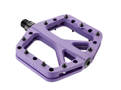 Purple bicycle pedal with black screws on a white background