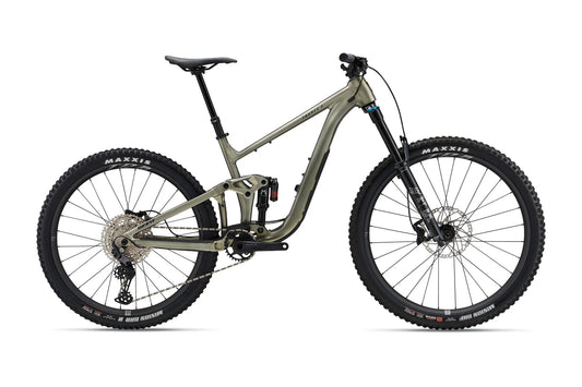 Mountain bike with a green frame and black tires on a white background