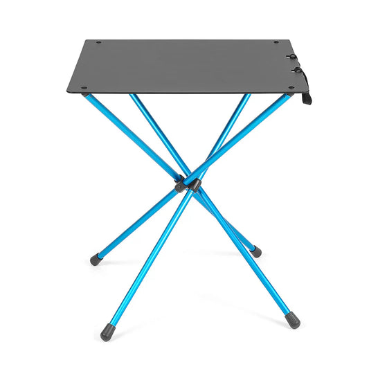 Portable folding table with blue legs and black top on a white background