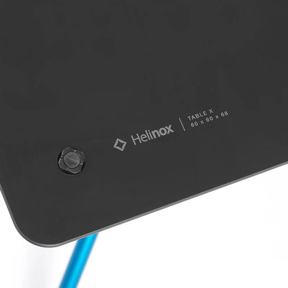 Close-up of a Helinox table X with branding and specifications.
