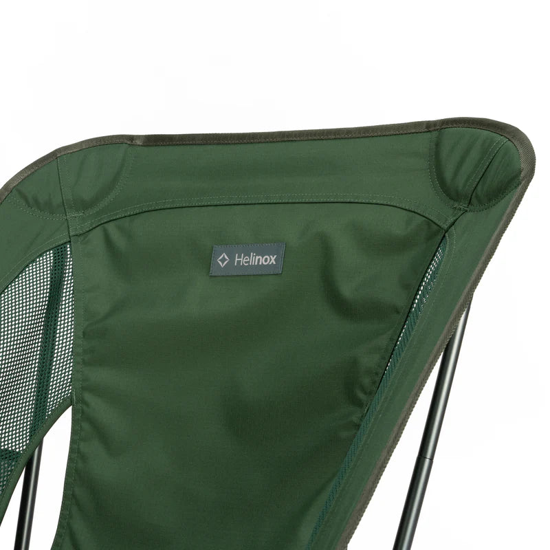 Green camping chair with Helinox logo on a white background