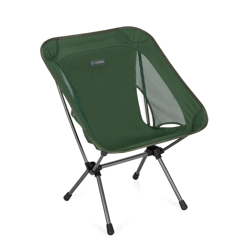 Green camping chair with a brand label on a white background