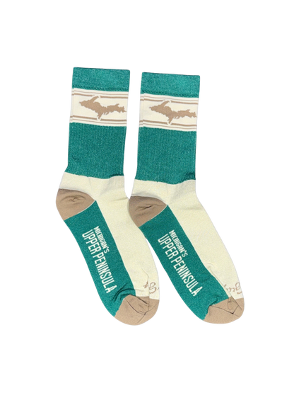 A pair of crew socks featuring a teal green and cream color scheme with a graphic of the Upper Peninsula of Michigan on the ribbed cuffs and printed on the toes.