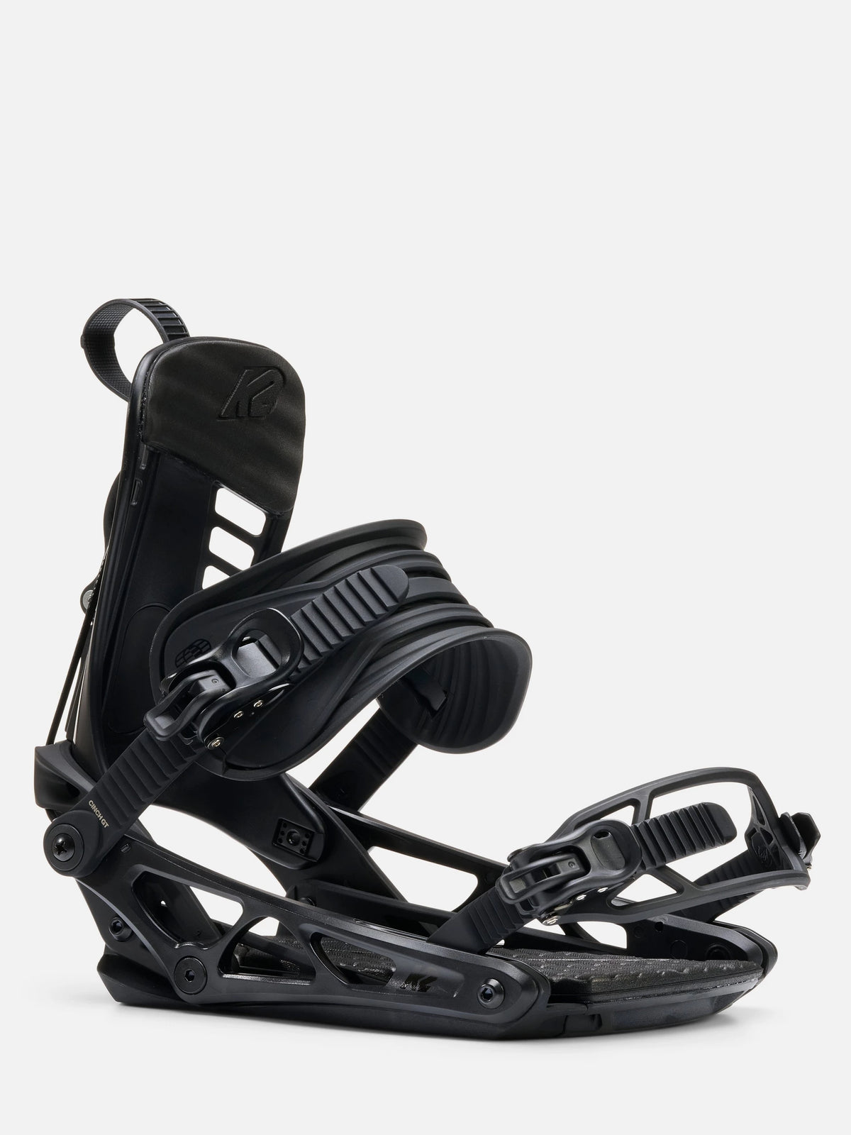 A single black snowboard binding shown from a side profile view against a clean, light gray studio background.
