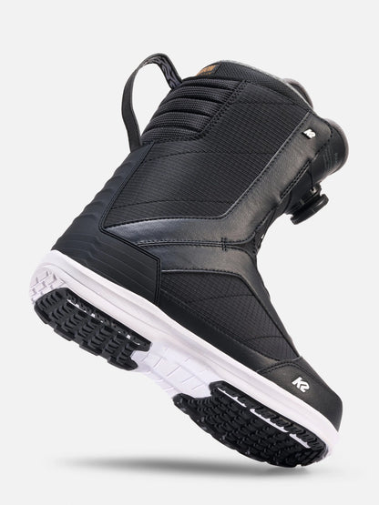 A black K2 snowboard boot with a white midsole, shown at a three-quarter angle against a light gray background.