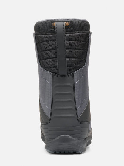 A single snowboard boot shown from the back on a light gray background. The boot is primarily black and dark gray with a textured design and a small orange 'Intuition' brand logo near the top collar.