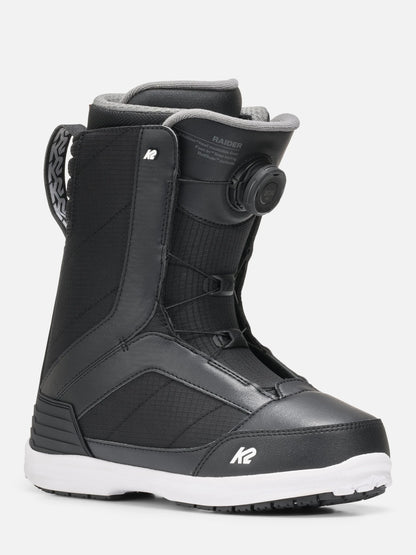 A black K2 Raider snowboard boot with a white sole, featuring a BOA dial closure system and a white K2 logo on the toe, shown against a light gray background.
