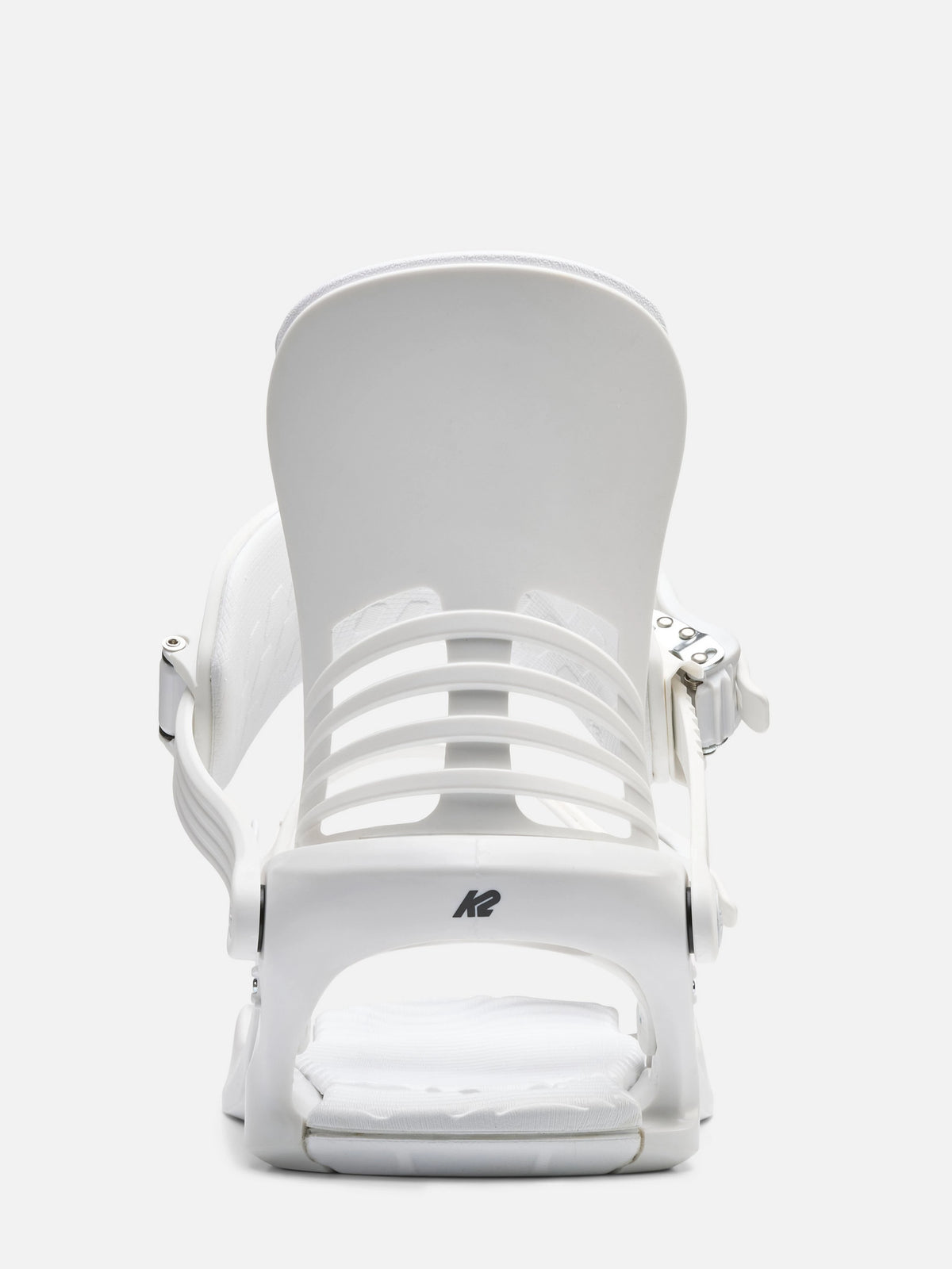 A white snowboard binding shown from the back on a clean, light gray studio background. The brand logo 'K2' is visible on the base.