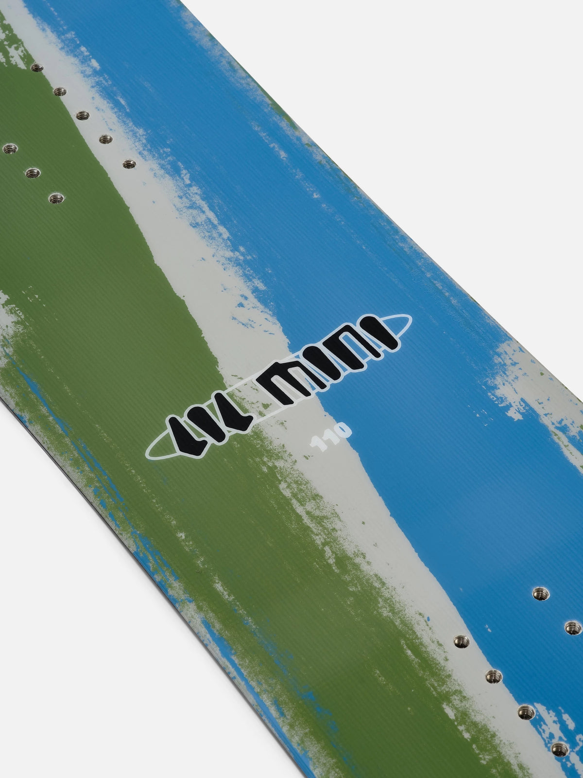 A close-up of a snowboard showing its base design with a diagonal split of blue and green, separated by a distressed white brushstroke. The words 'LIL MINI' are printed in black stylized text with a white outline, and small metallic rivets line the edge.