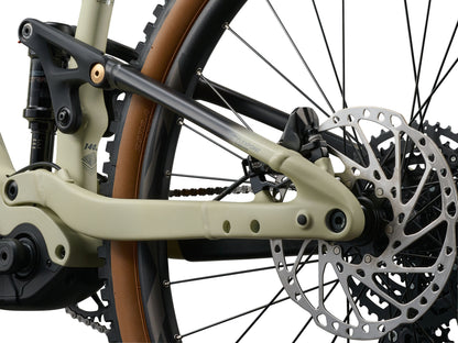 Close-up of a bicycle's chain mechanism and disc brake on a white background