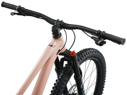 Close-up of a bicycle handlebar and front wheel on a white background