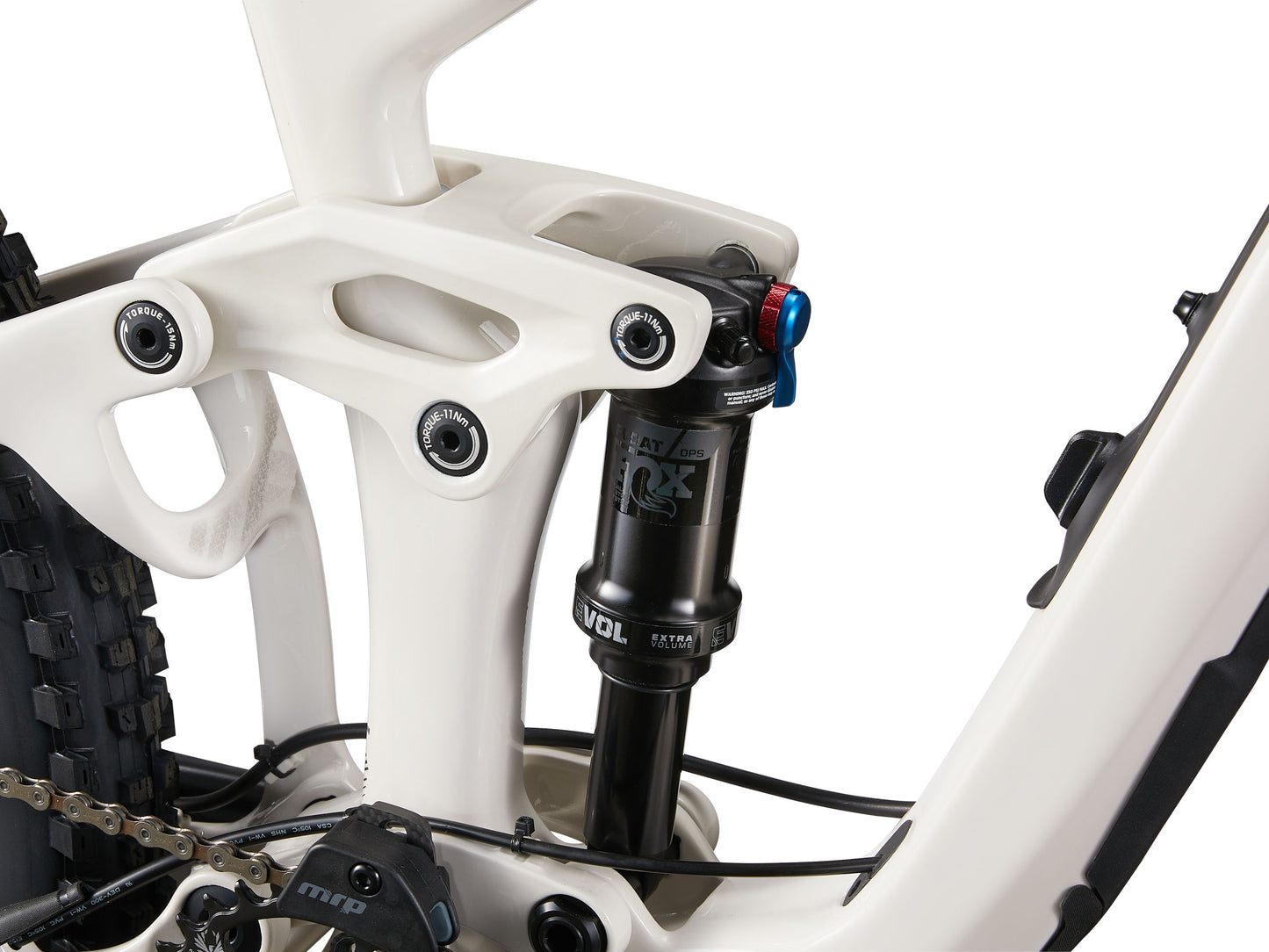 Close-up of a bicycle suspension fork with white frame and black components on a white background