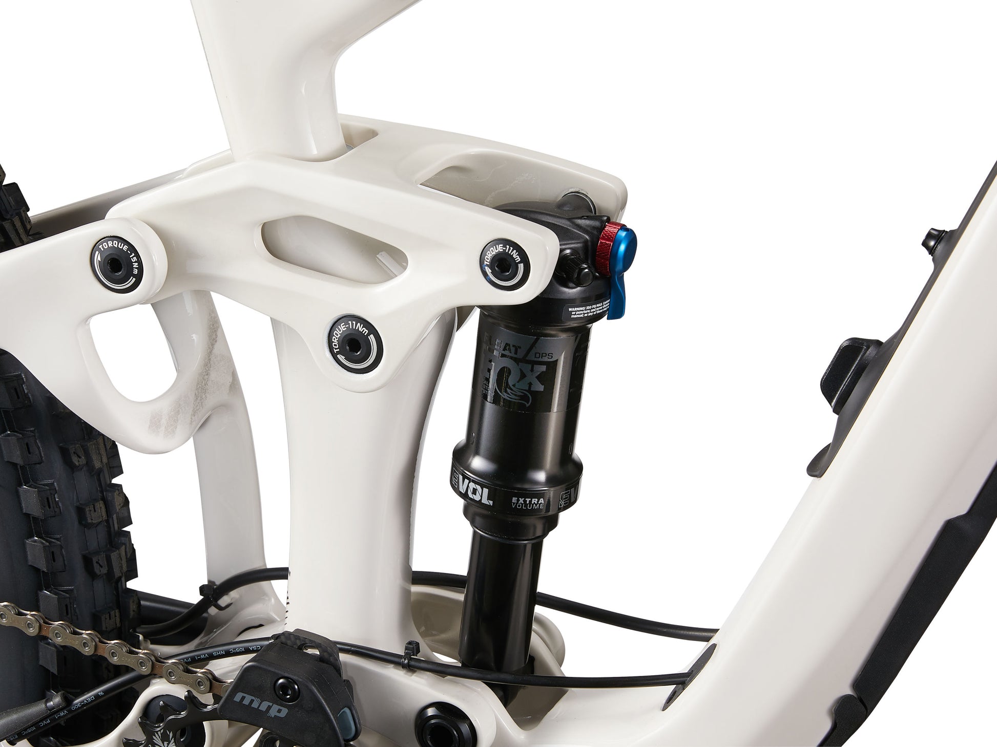 Close-up of a bicycle suspension fork with white frame and black components on a white background