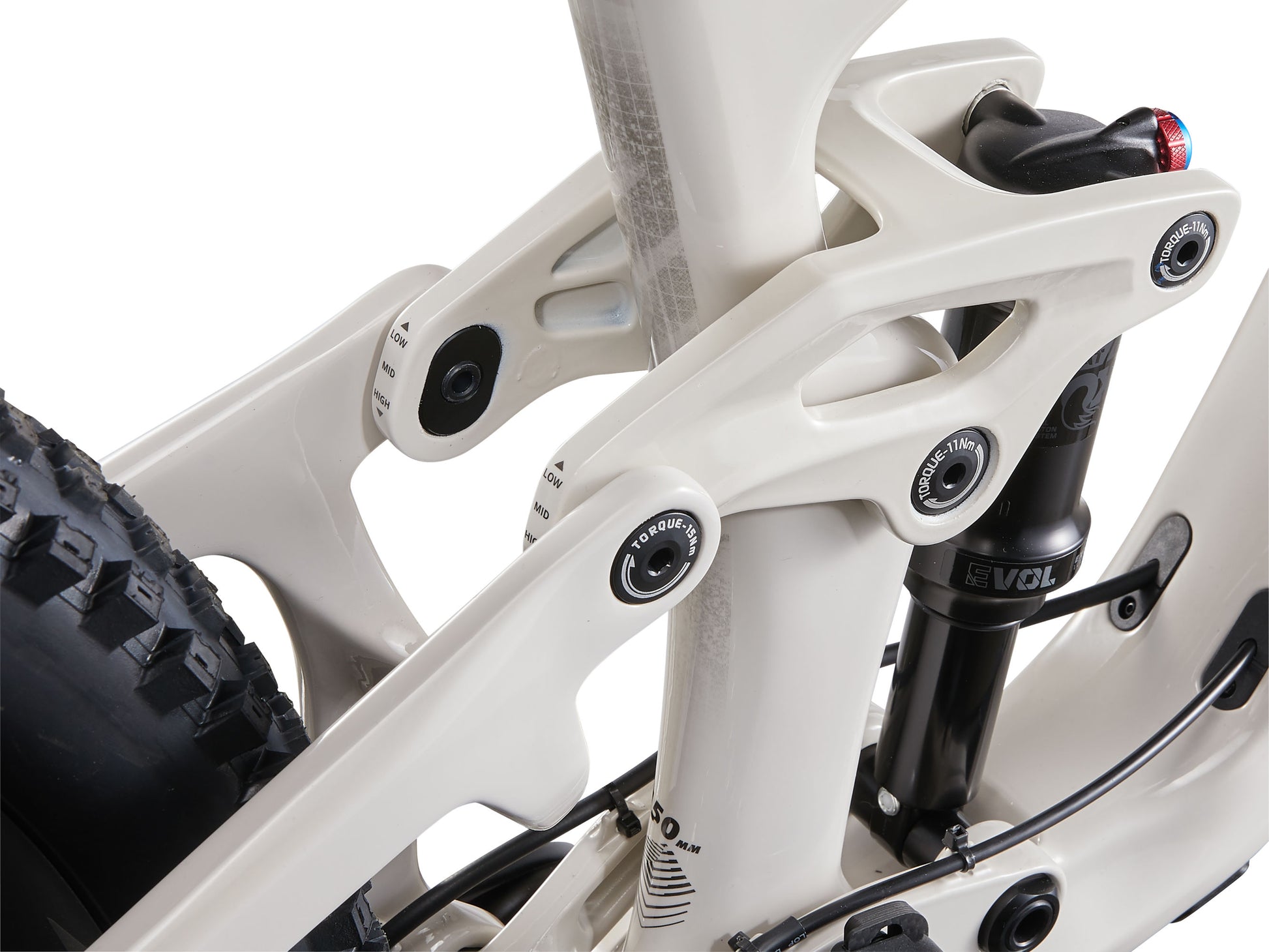 Close-up of a bicycle frame with white and black components on a white background