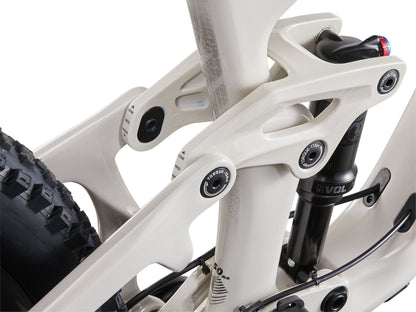 Close-up of a bicycle frame with white and black components on a white background