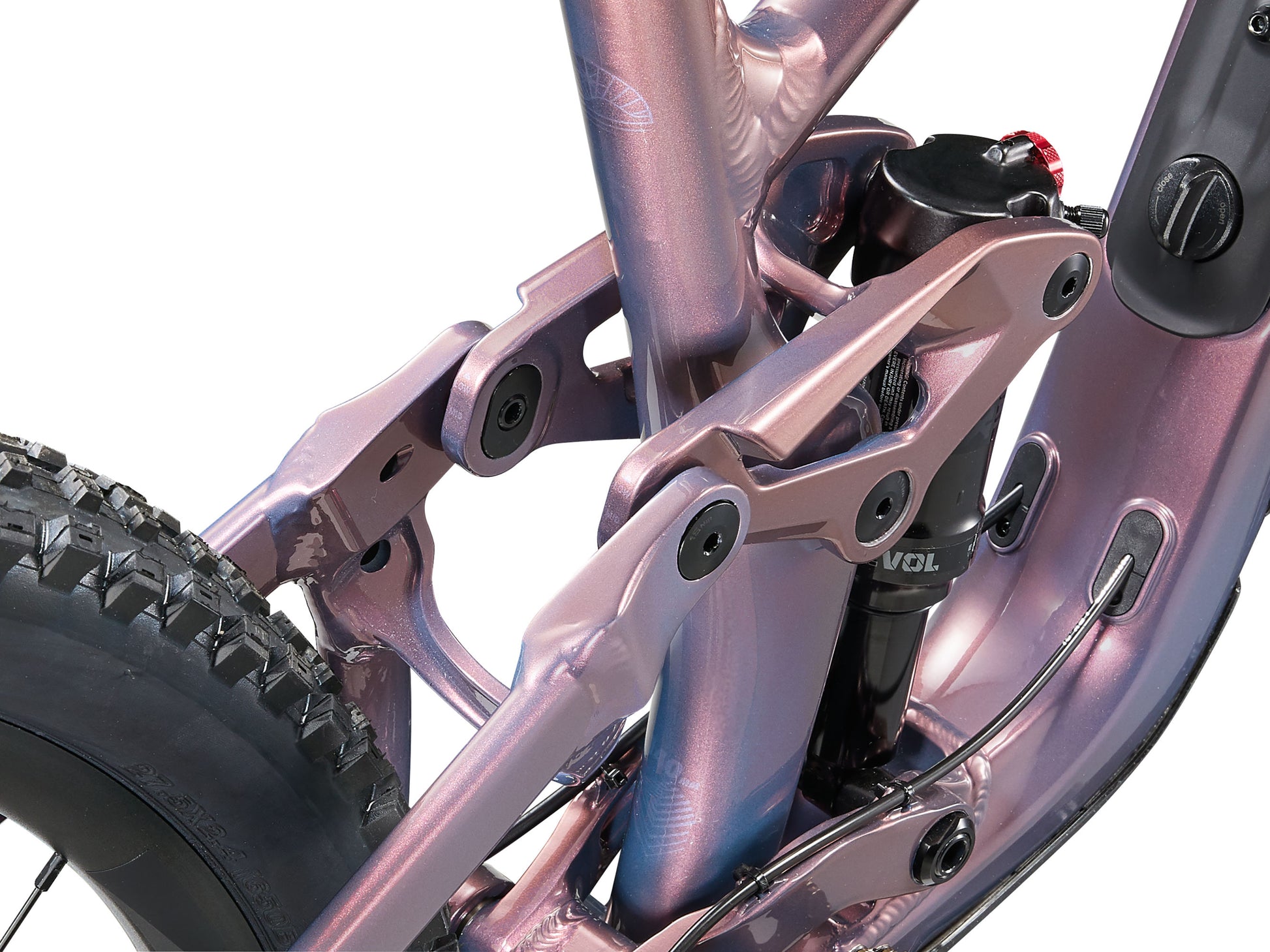Close-up of a bicycle suspension fork with a metallic finish on a white background