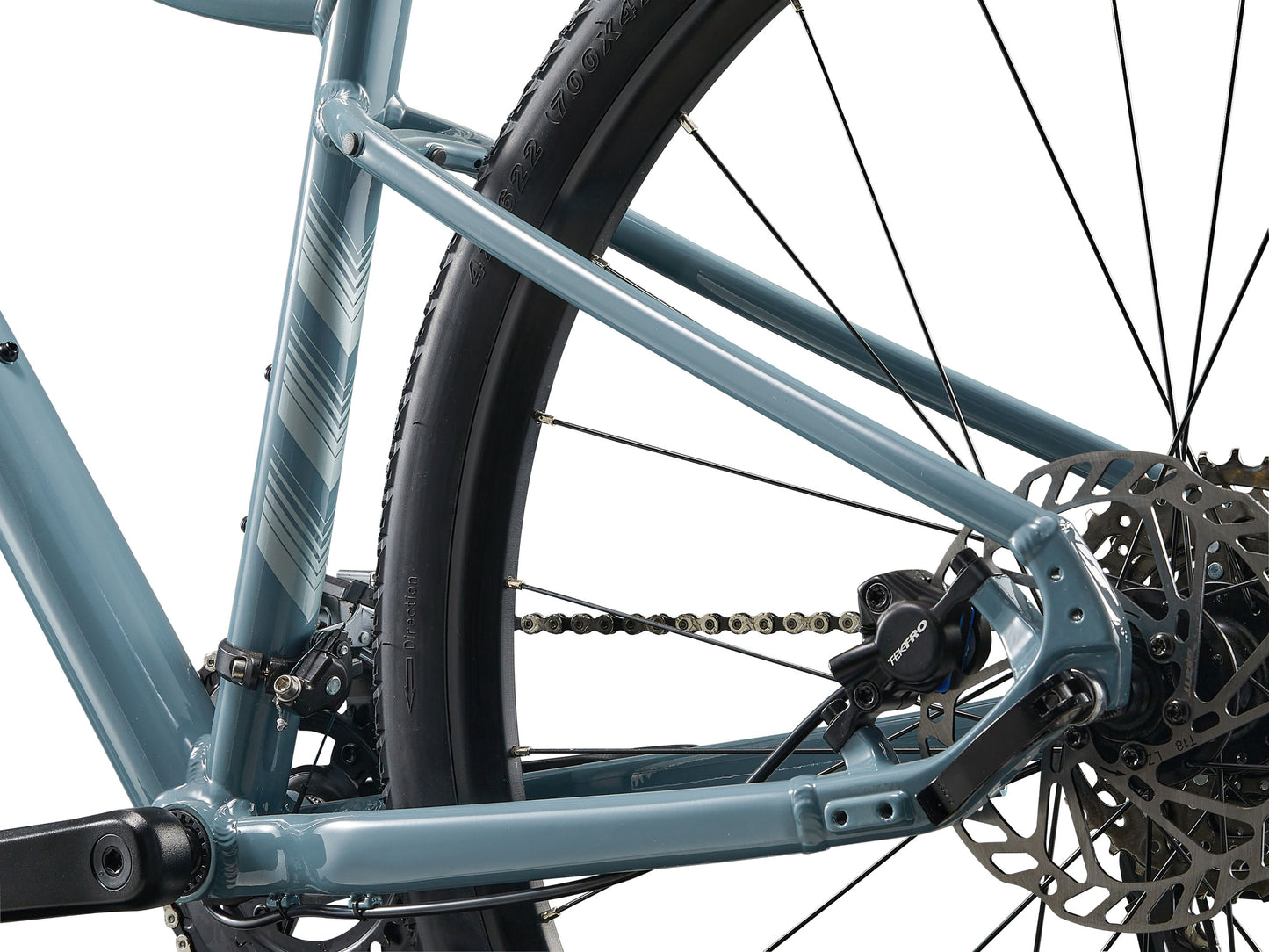 Close-up of a bicycle's chain and gear system on a white background