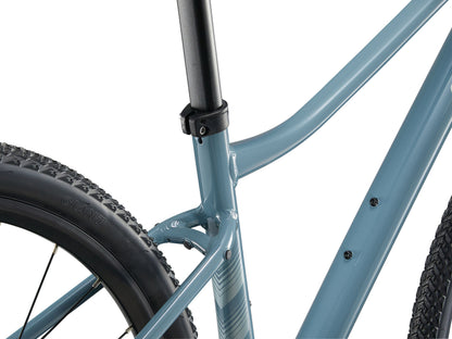 Close-up of a blue bicycle frame with a white background