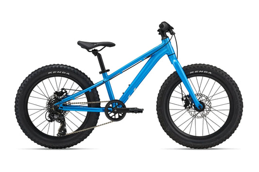 Blue children's bike with thick tires on a white background