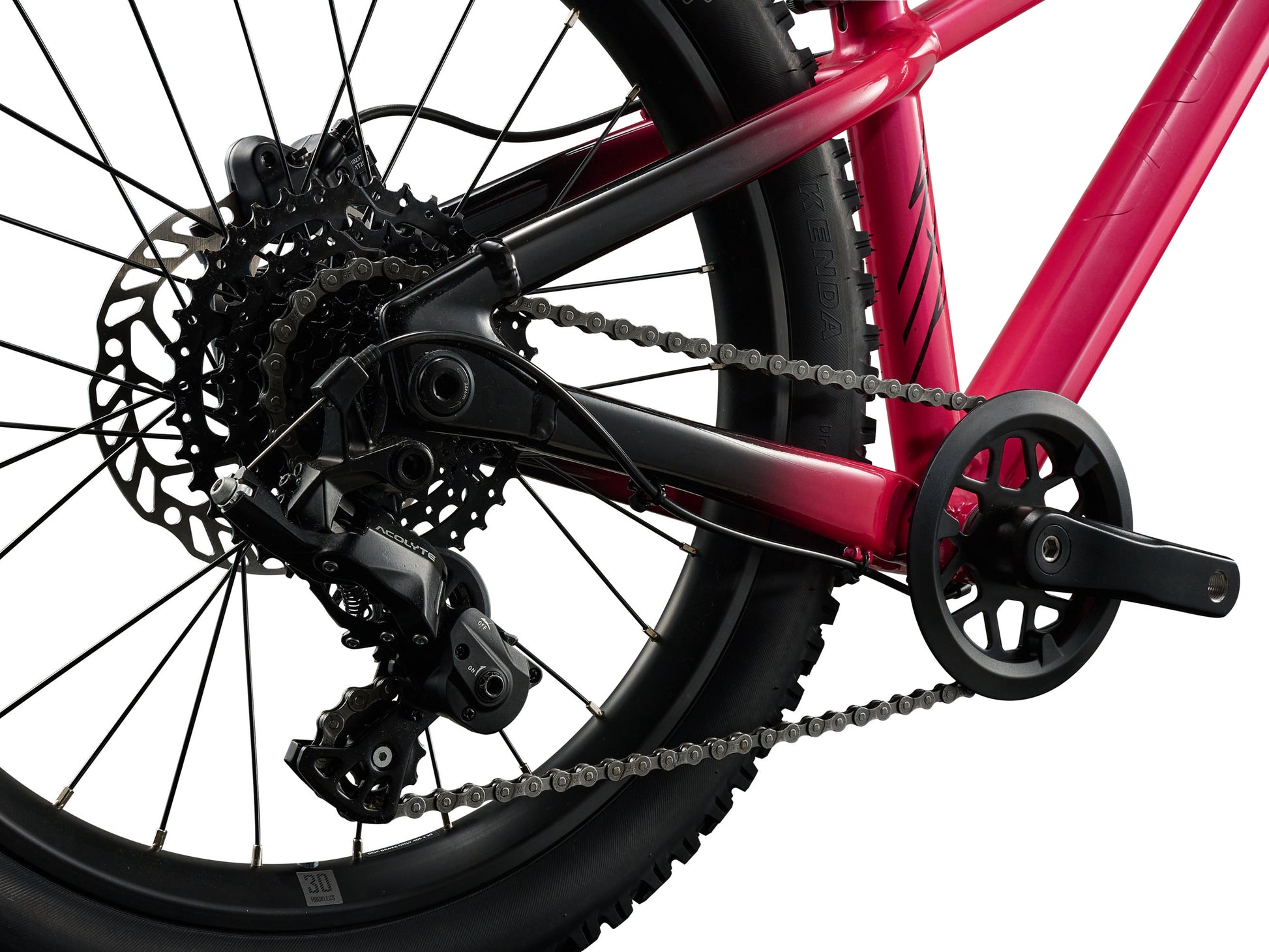 Close-up of a red bicycle's gear system on a white background