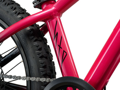 Close-up of a red bicycle frame with 'MTD' branding on a white background