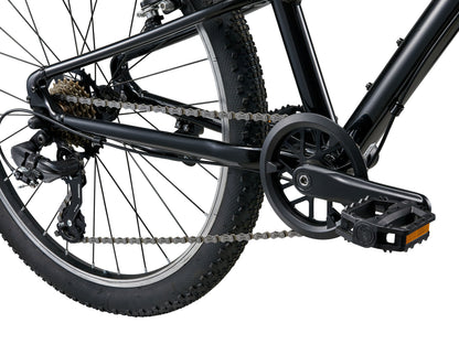 Close-up of a bicycle chain and gear system on a white background