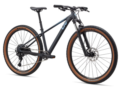 Mountain bike with black frame and brown tires on a white background