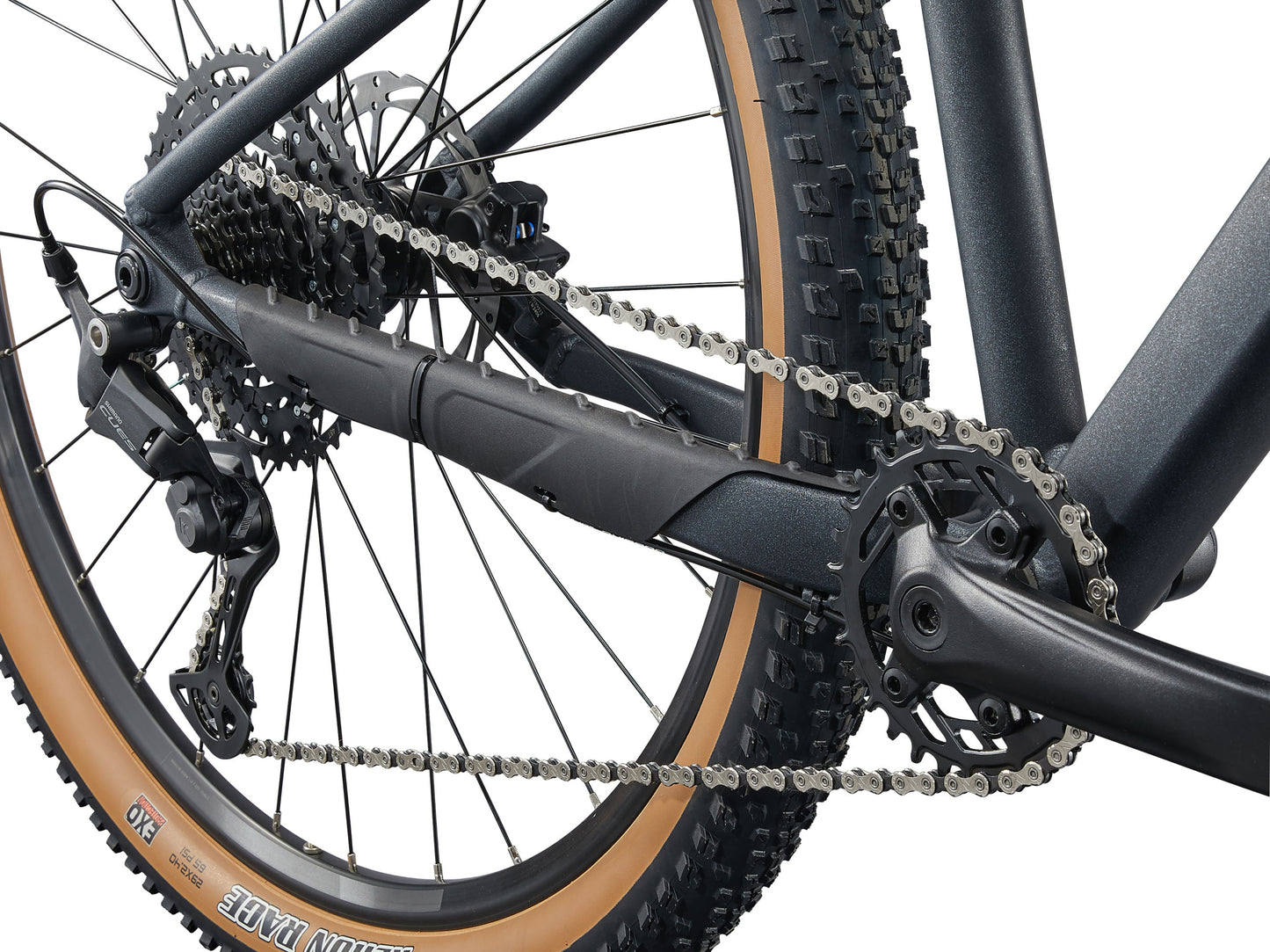 Close-up of a bicycle chain and gear system on a white background