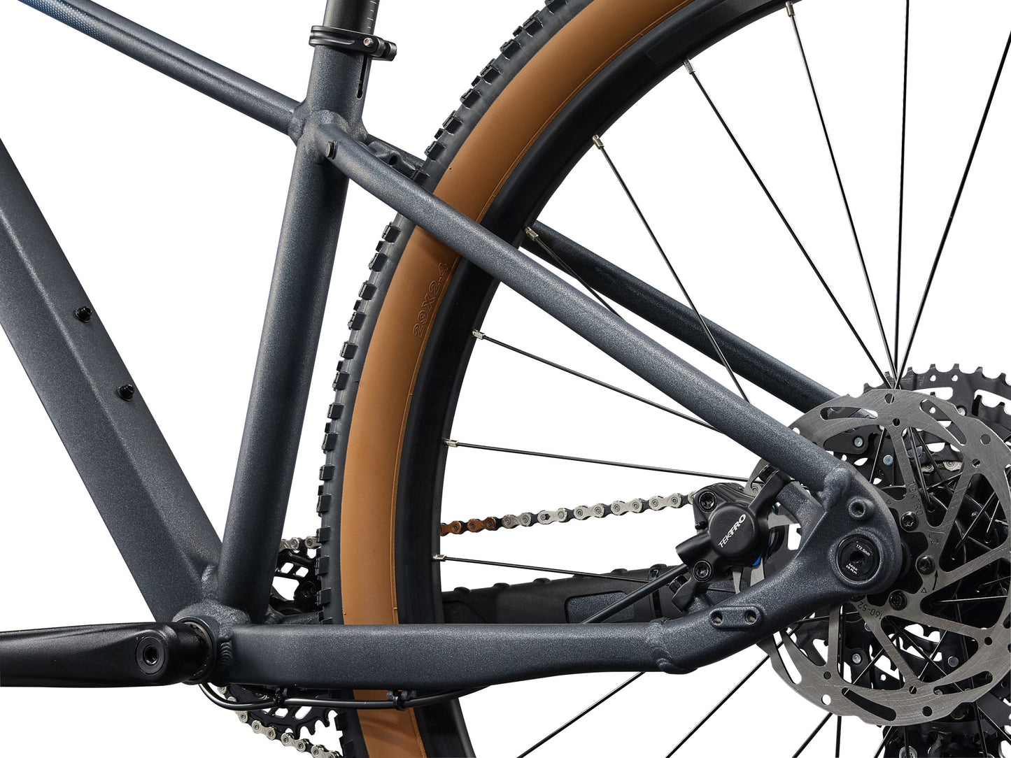 Close-up of a bicycle chain and gear system on a white background