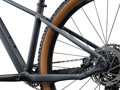 Close-up of a bicycle chain and gear system on a white background
