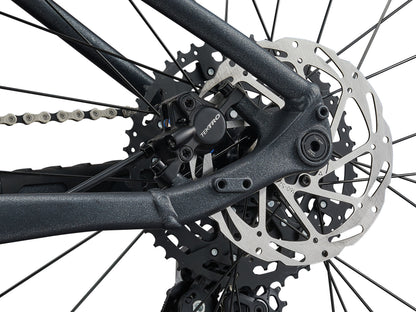 Close-up of a bicycle's gear system with a white background