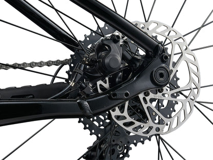 Close-up of a bicycle's gear system with a white background