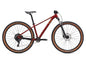 Red mountain bike with brown tires on a white background