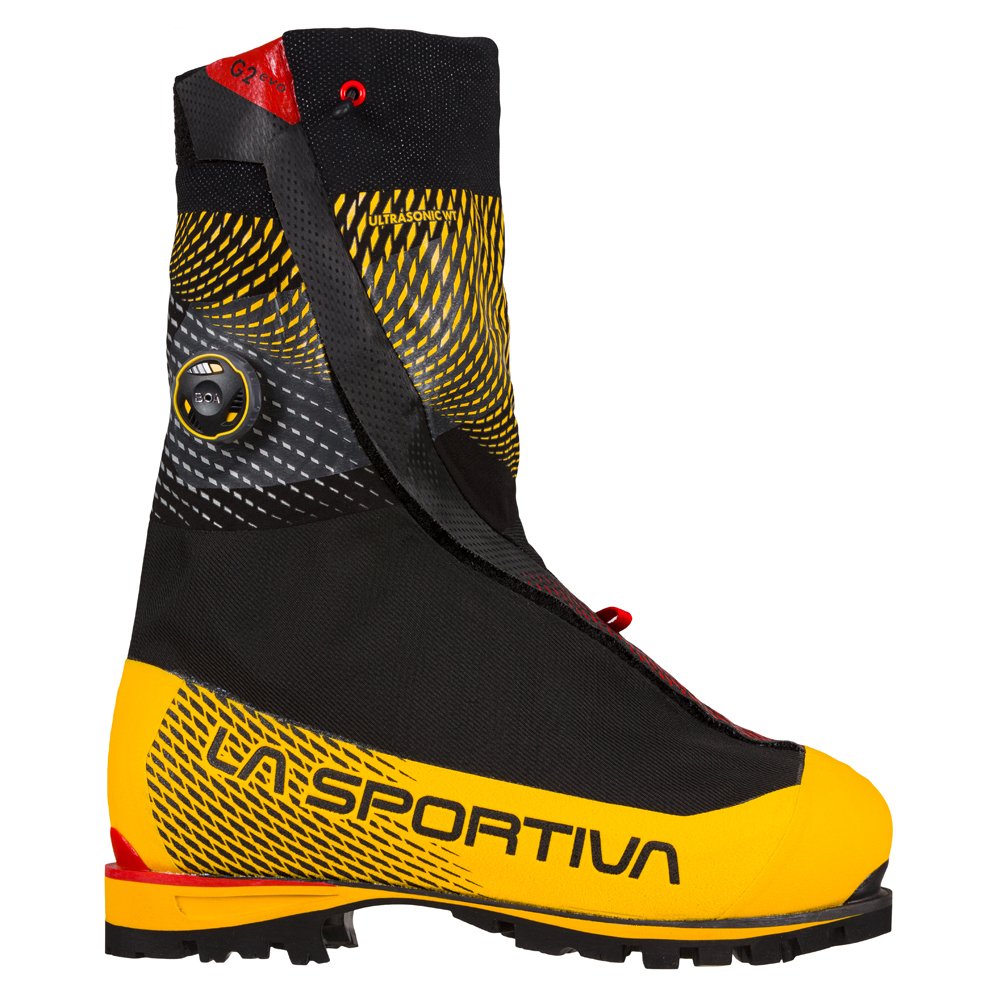 Black and yellow climbing boot with red accents on a white background