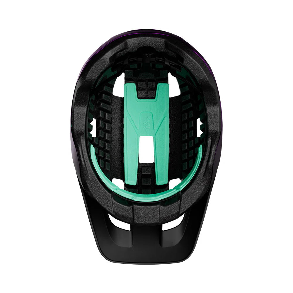 Black and teal bike seat with a white background