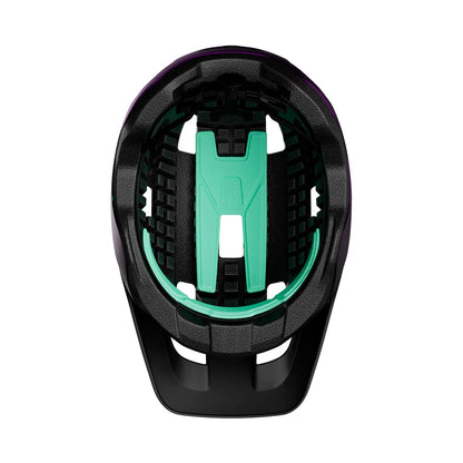 Black and teal bike seat with a white background
