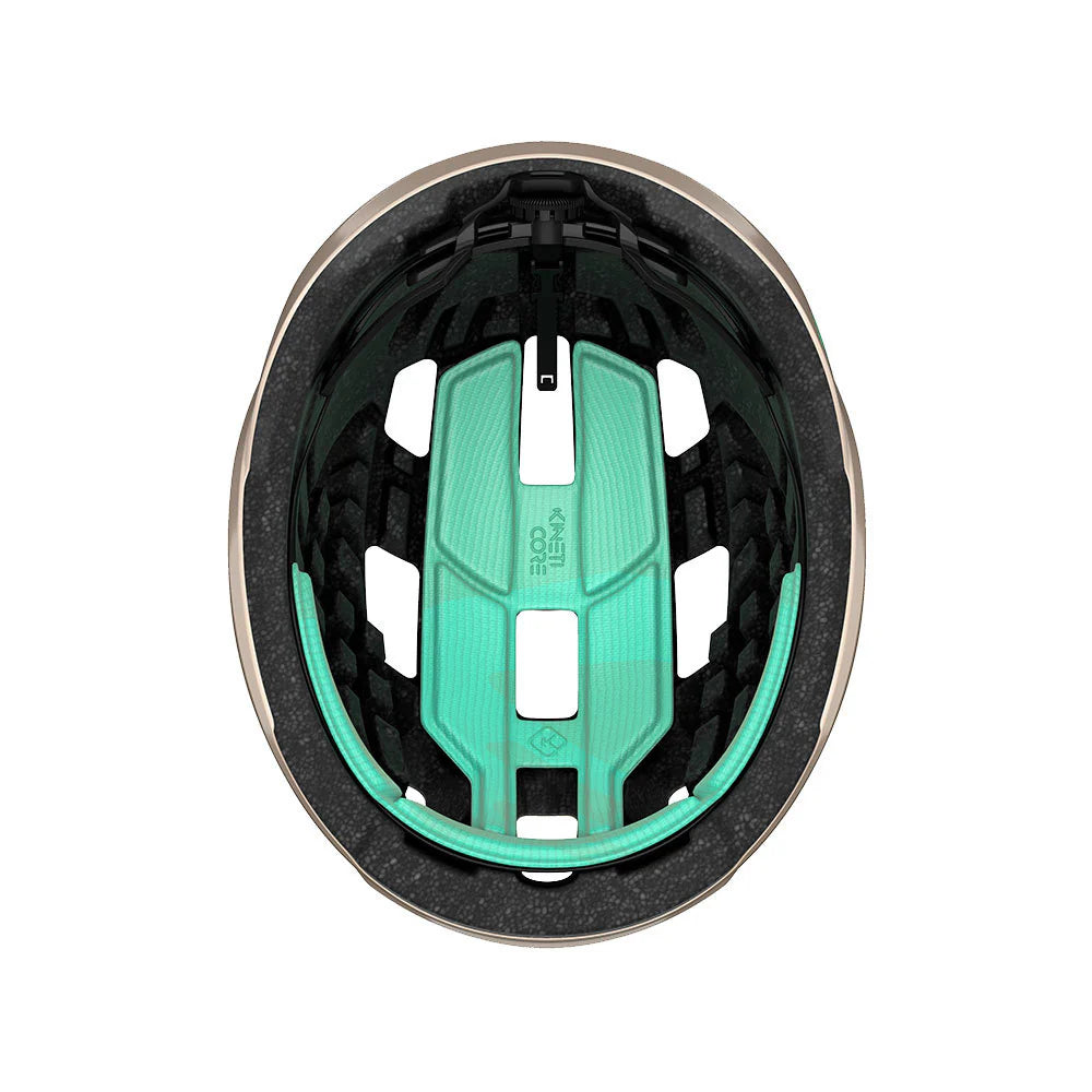 Close-up of a helmet interior with green padding on a white background